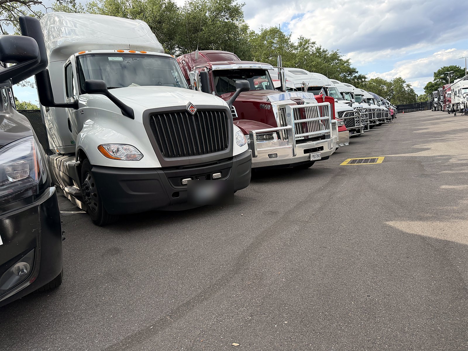 CW semi tractors lined up in a row